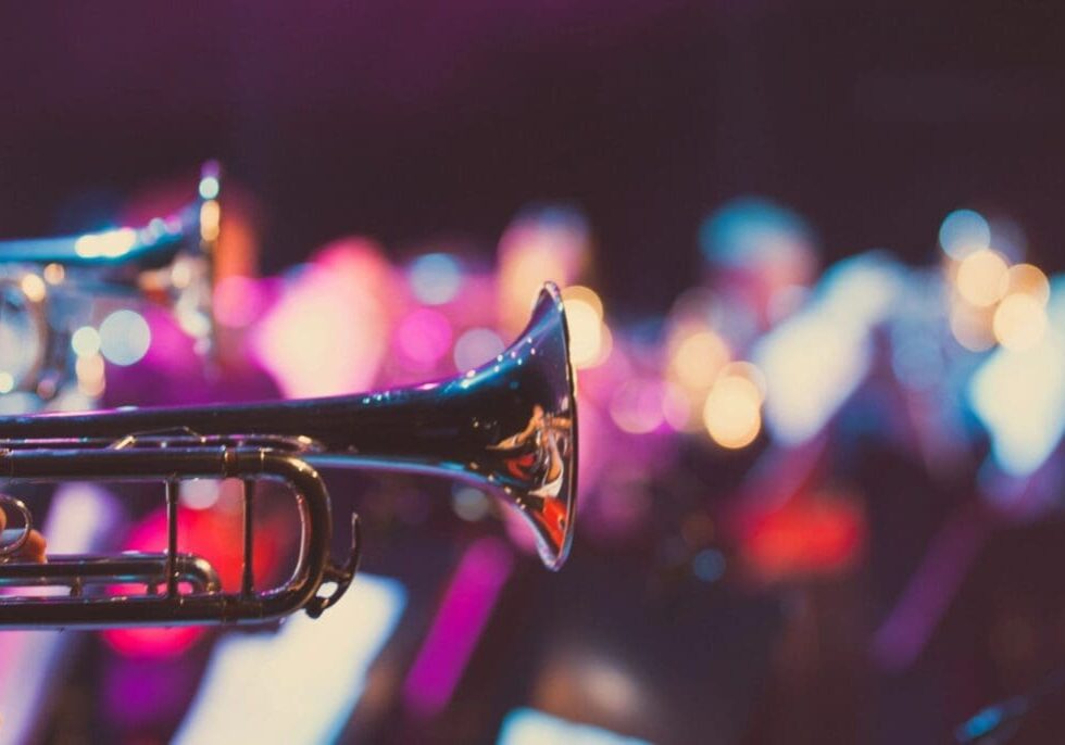 Trumpet in a colorful concert setting.